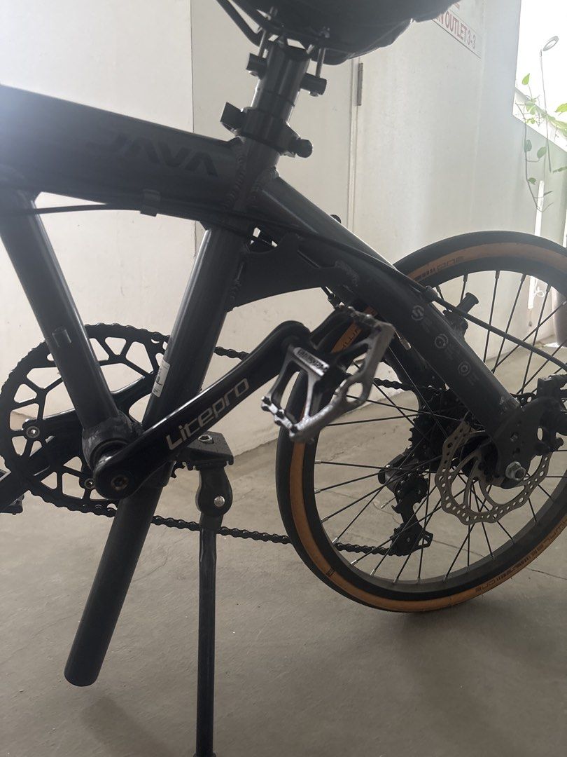 JAVA TT Foldable Bike (Category: Bicycles) located in Singapore. Submitted by fzhmdn (Listing ID 1460378182, Image 2). Description: - Upgraded with Litepro components - Equipped with reliable disc brakes - Schwalbe skin wall tires (upgraded from original tyres) - Perfect for commuting and casual rides - Well-maintained and ready for a new owner Meet up at Block 188A Marsiling Road.