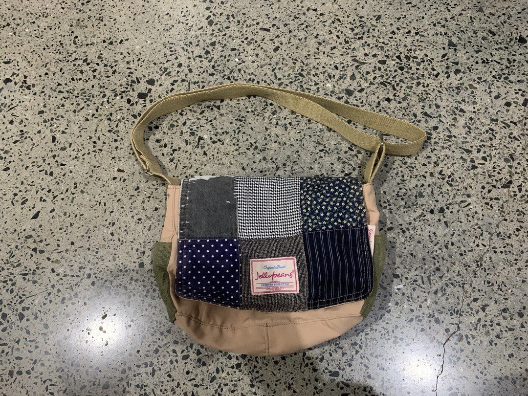Jellybeans Patchwork Messenger Bag (Category: Cross-body Bags) located in Las Pinas. Submitted by p.j.c.a.r.o.u.s.e.l.l.i.n.g (Listing ID 1460325485, Image 1). Description: - Cute patchwork messenger bag from Jollybeans - Features a variety of fabric patterns on the front flap - Tan and olive green body - Adjustable strap for comfortable wear - Ideal for everyday use - Spacious interior for your essentials Flaws: small wear and tear in front (bar