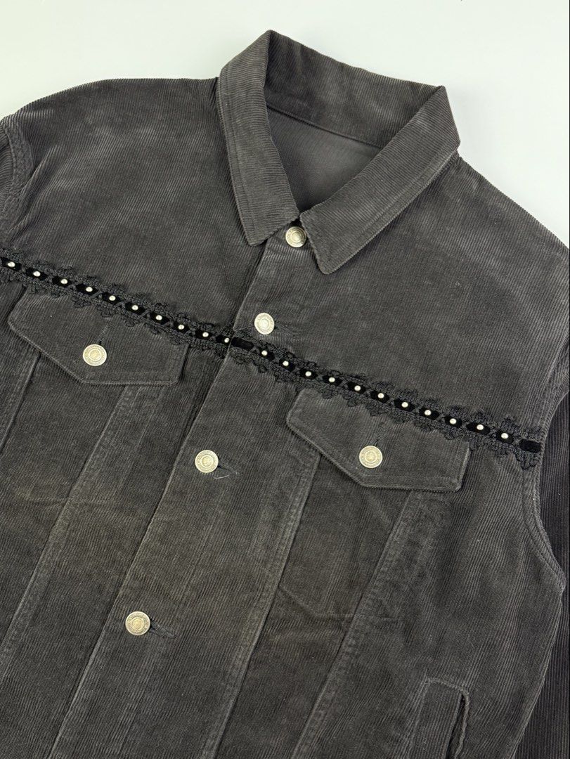 JohnUndercover - A/W18 - Studded Corduroy Jacket (Category: Coats, Jackets and Outerwear) located in Pasig City. Submitted by on_the_trend (Listing ID 1460493392, Image 3). Description: Tagged size: 4 Condition: 8/10 Flaws: Archive piece with natural aging. Features a beautiful minor overall fade across the cotton corduroy fabric. There is a visible sun-faded / oxidized reddish tint on the front panels by the buttons, which adds a distinct vintag