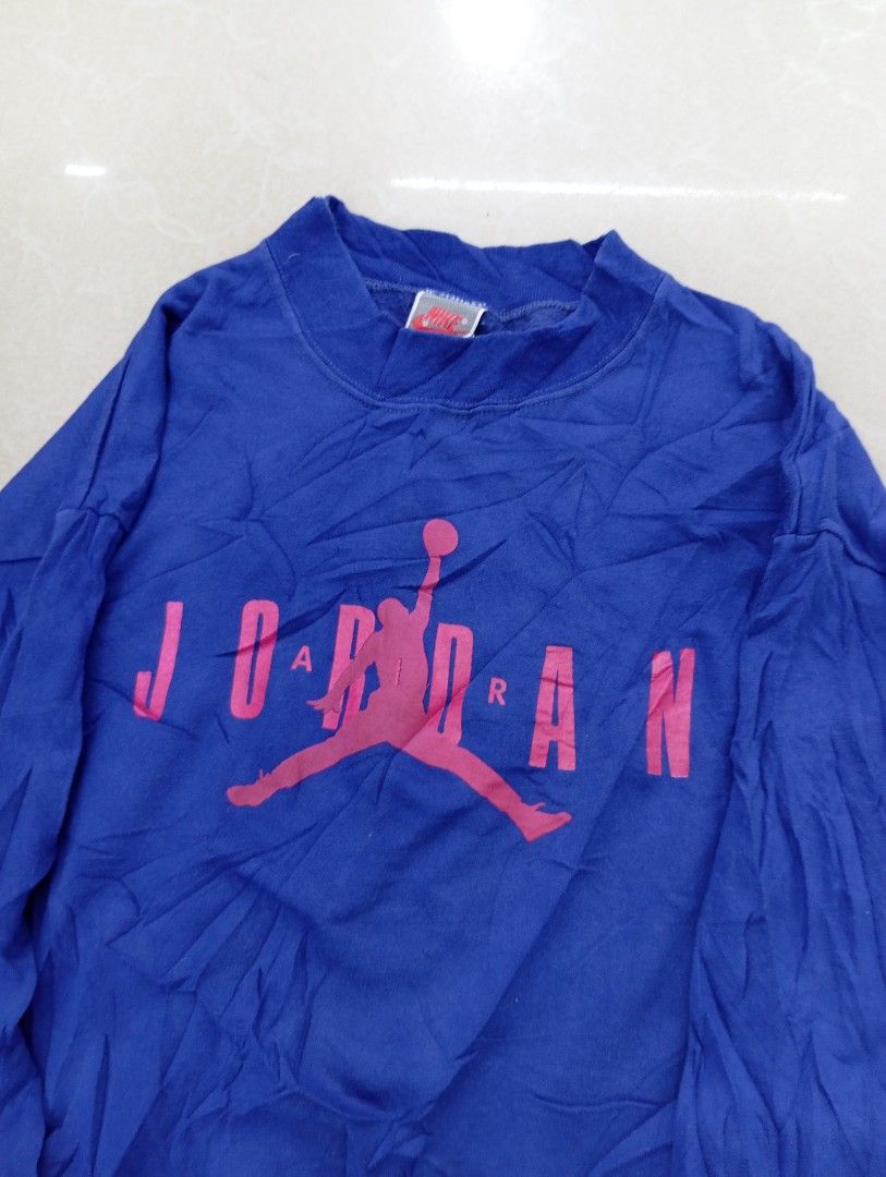Jordan Nike VINTAGE (Category: Coats, Jackets and Outerwear) located in Manila. Submitted by brugodoy (Listing ID 1460362185, Image 2). Description: - Blue Jordan sweatshirt - Features iconic pink Jumpman logo and Jordan text - Made in USA - Boys' size X-Large (fits 18-20) - Body: Cotton/Polyester blend - Cuff: 100% Cotton - Ideal for casual wear.