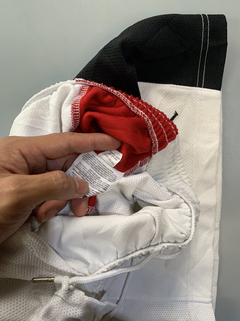 Jordan Shorts White Red Black Size L (Category: Shorts) located in Manila. Submitted by safefire_e3a28b (Listing ID 1460314912, Image 2). Description: - White Jordan shorts - Red and black accents - Elastic waistband with drawstring - Jordan logo on right leg - Made in Thailand - Size L - Minor faint marks on lower left leg (please check photos).