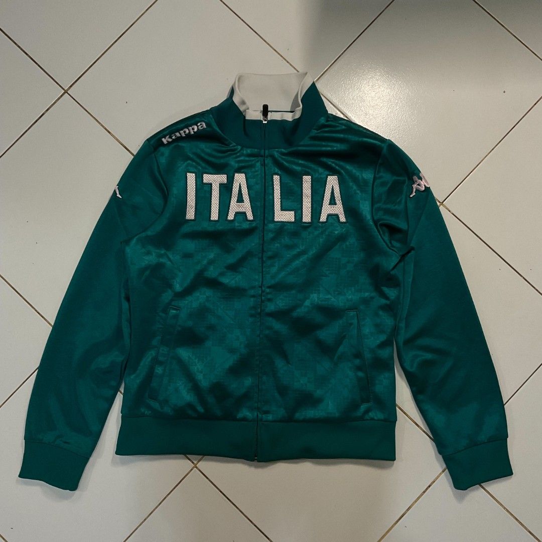 Kappa Italia Track Jacket Green (Category: Coats, Jackets and Outerwear) located in Morong. Submitted by rusty.vault (Listing ID 1460416141, Image 2). Description: - Green Kappa track jacket - Features 'ITALIA' text on the front - Kappa logo on chest and sleeves - Zip-up closure - Ribbed cuffs and hem - Perfect for casual wear or sports.