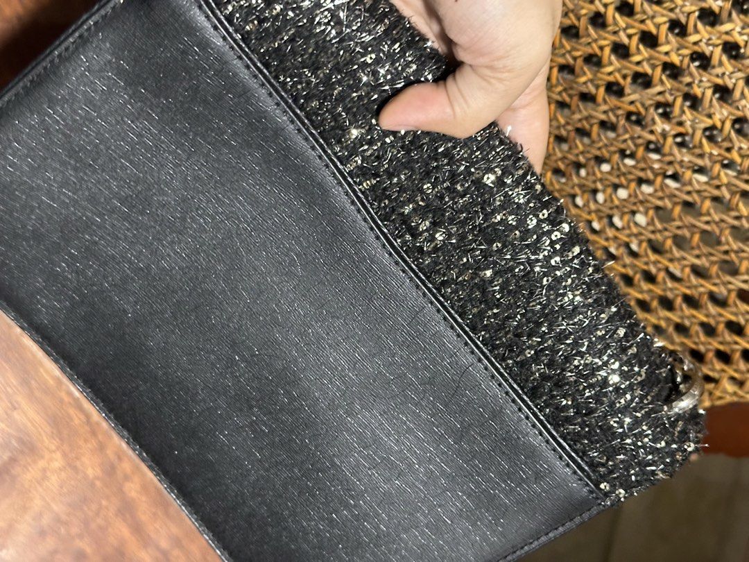 Kate Spade Black Tweed & Leather Shoulder Bag (Category: Shoulder Bags) located in Makati City. Submitted by alpacaborahae (Listing ID 1460414852, Image 3). Description: - Elegant black leather and tweed shoulder bag - Features a sparkly tweed front panel - Secure silver clasp closure with Kate Spade New York logo - Versatile chain and leather strap - Ideal for evening events or adding flair to any outfit.