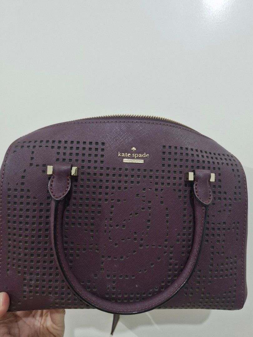 Kate Spade Perforated Satchel Handbag (Category: Luxury Bags & Wallets) located in Valenzuela. Submitted by eunze (Listing ID 1460377143, Image 1). Description: - Authentic Purple Kate Spade Handbag - Unique all-over perforated design - Secure zip closure - Interior features classic striped lining and convenient pockets - Comfortable top handles - Elegant gold hardware details - Ideal for everyday style and practicality.