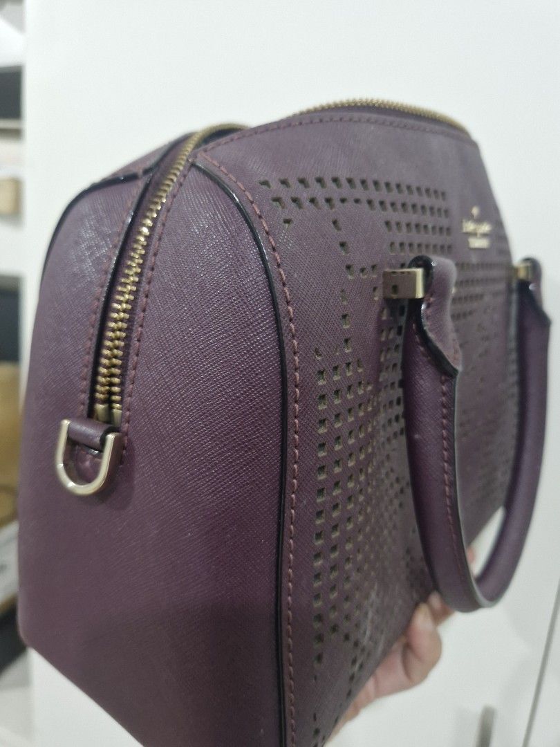 Kate Spade Perforated Satchel Handbag (Category: Luxury Bags & Wallets) located in Valenzuela. Submitted by eunze (Listing ID 1460377143, Image 3). Description: - Authentic Purple Kate Spade Handbag - Unique all-over perforated design - Secure zip closure - Interior features classic striped lining and convenient pockets - Comfortable top handles - Elegant gold hardware details - Ideal for everyday style and practicality.
