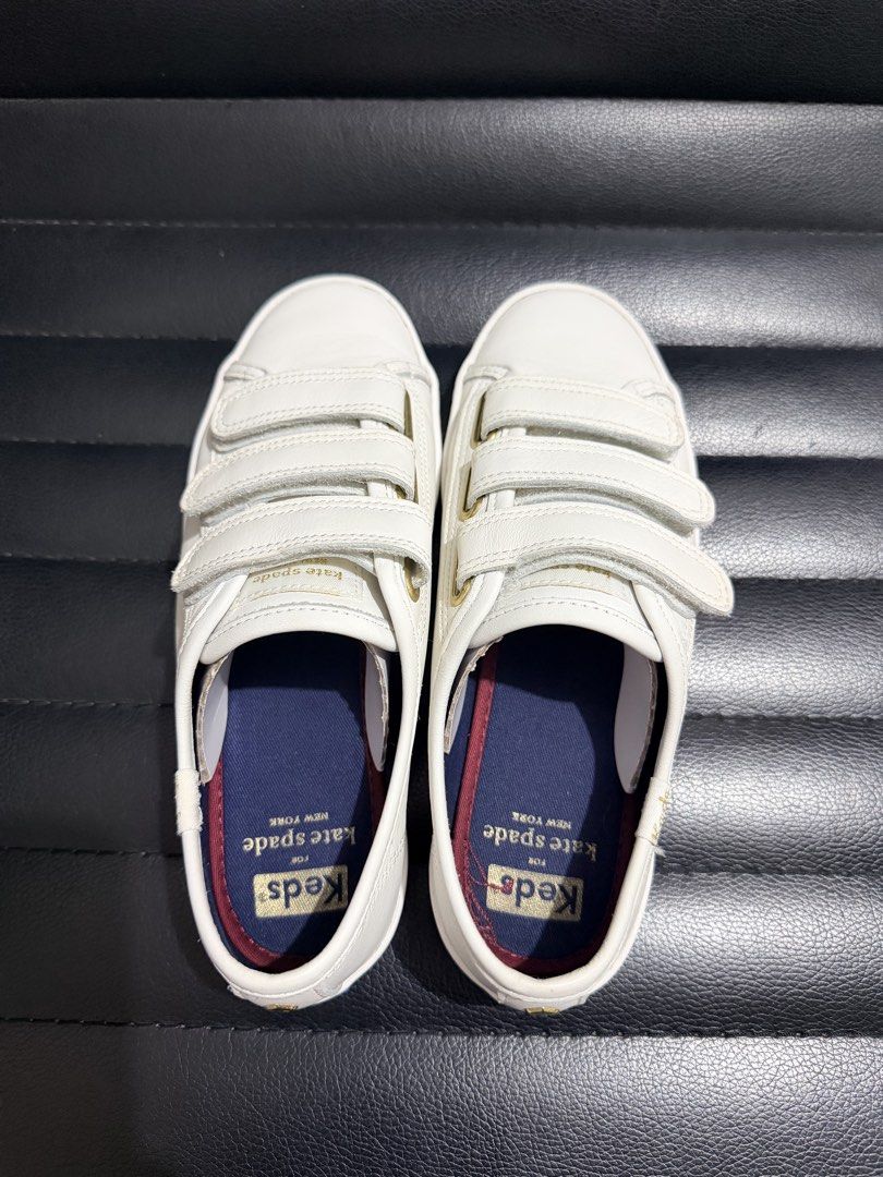 Keds x Kate Spade Sneakers (Category: Sneakers) located in Dinalupihan. Submitted by laviajeraph (Listing ID 1460346212, Image 2). Description: 👟 KEDS x KATE SPADE NEW YORK TIEBREAKER SNEAKERS ✨ White leather sneakers featuring a triple hook-and-loop Velcro strap design with elegant gold-tone eyelet accents. 💕 Classic, chic, and easy to pair with any outfit—perfect for everyday wear! 📸 Actual photos posted. Please check photos for condition/de