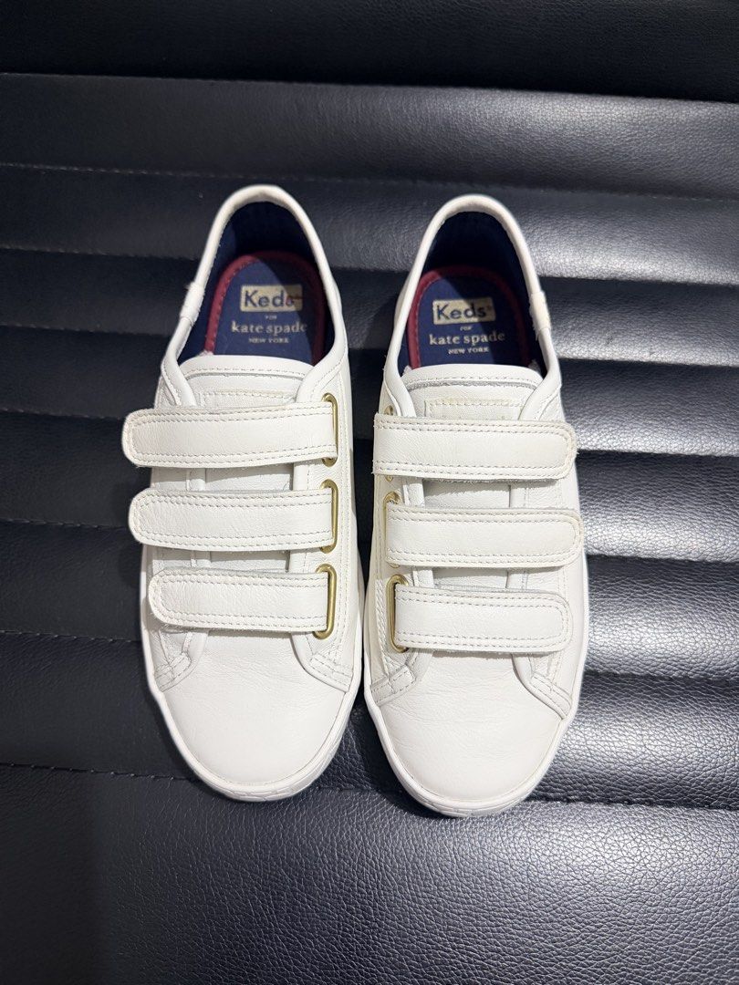 Keds x Kate Spade Sneakers (Category: Sneakers) located in Dinalupihan. Submitted by laviajeraph (Listing ID 1460346212, Image 1). Description: 👟 KEDS x KATE SPADE NEW YORK TIEBREAKER SNEAKERS ✨ White leather sneakers featuring a triple hook-and-loop Velcro strap design with elegant gold-tone eyelet accents. 💕 Classic, chic, and easy to pair with any outfit—perfect for everyday wear! 📸 Actual photos posted. Please check photos for condition/de