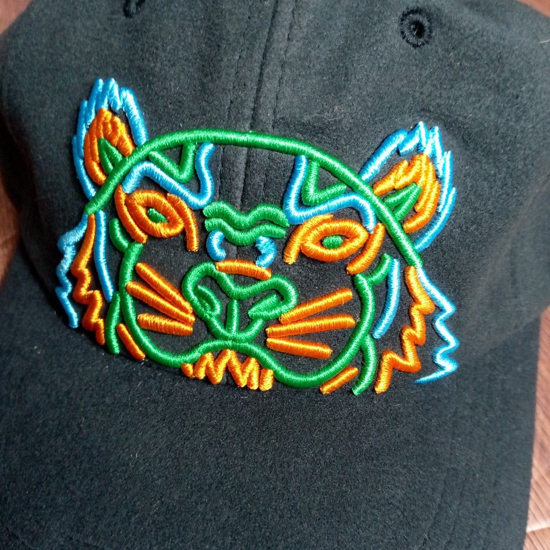 Kenzo Paris Black Embroidered Tiger Face Baseball Cap (Category: Caps & Hats) located in Manila. Submitted by pablopresk0. (Listing ID 1460493570, Image 2). Description: - Iconic Kenzo tiger face embroidered on the front. - Kenzo Paris logo on the side and back strap. CAPFOR SALE🧢 EXCELLENT CONDITION ✅ MANILA LOCATION 📍 JNT/LBC/LALAMOVE 📦 PM IF INTERESTED 📩.
