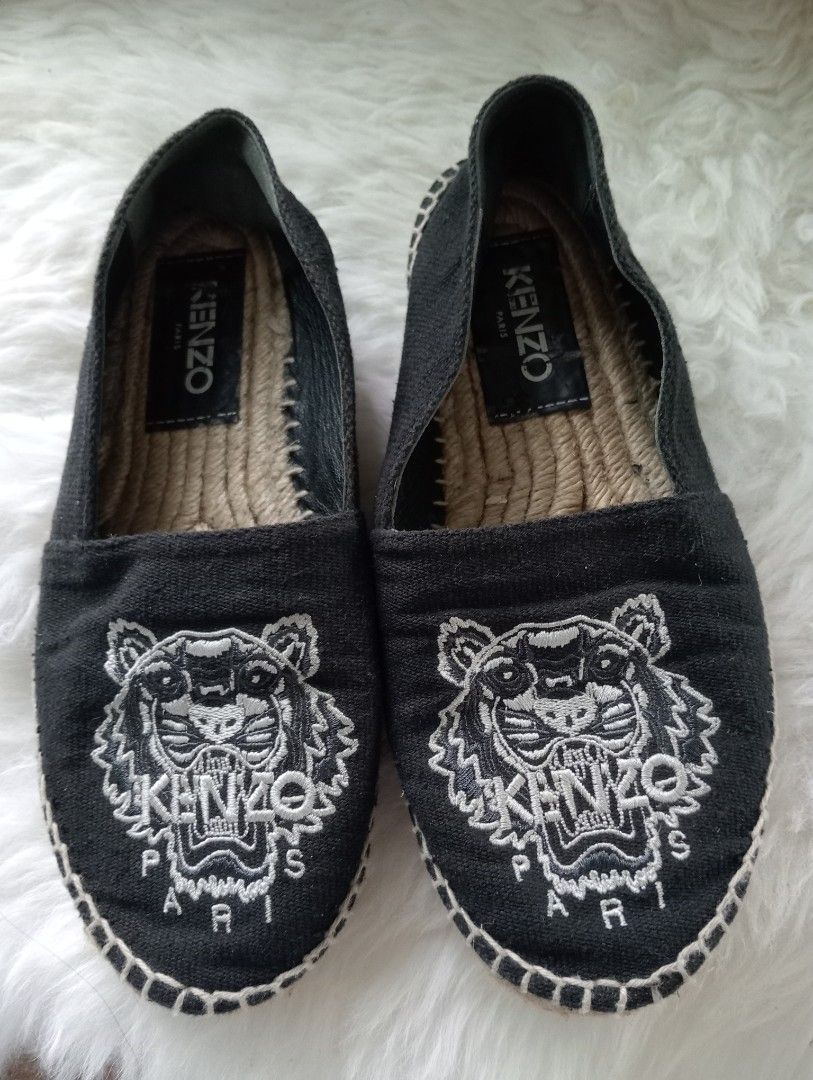 Kenzo Paris Tiger Espadrilles Flats Shoes (Category: Flats & Sandals) located in Cabadbaran. Submitted by lioness_cave (Listing ID 1460385895, Image 1). Description: - Brand: Kenzo - Color: Black - Style: Espadrilles - Size: 36 - Features: Iconic tiger embroidery - Sole: Jute - Closure: Slip-on - Occasion: Casual wear signs of use., minor issue on name po. meron peel off area ng leather .