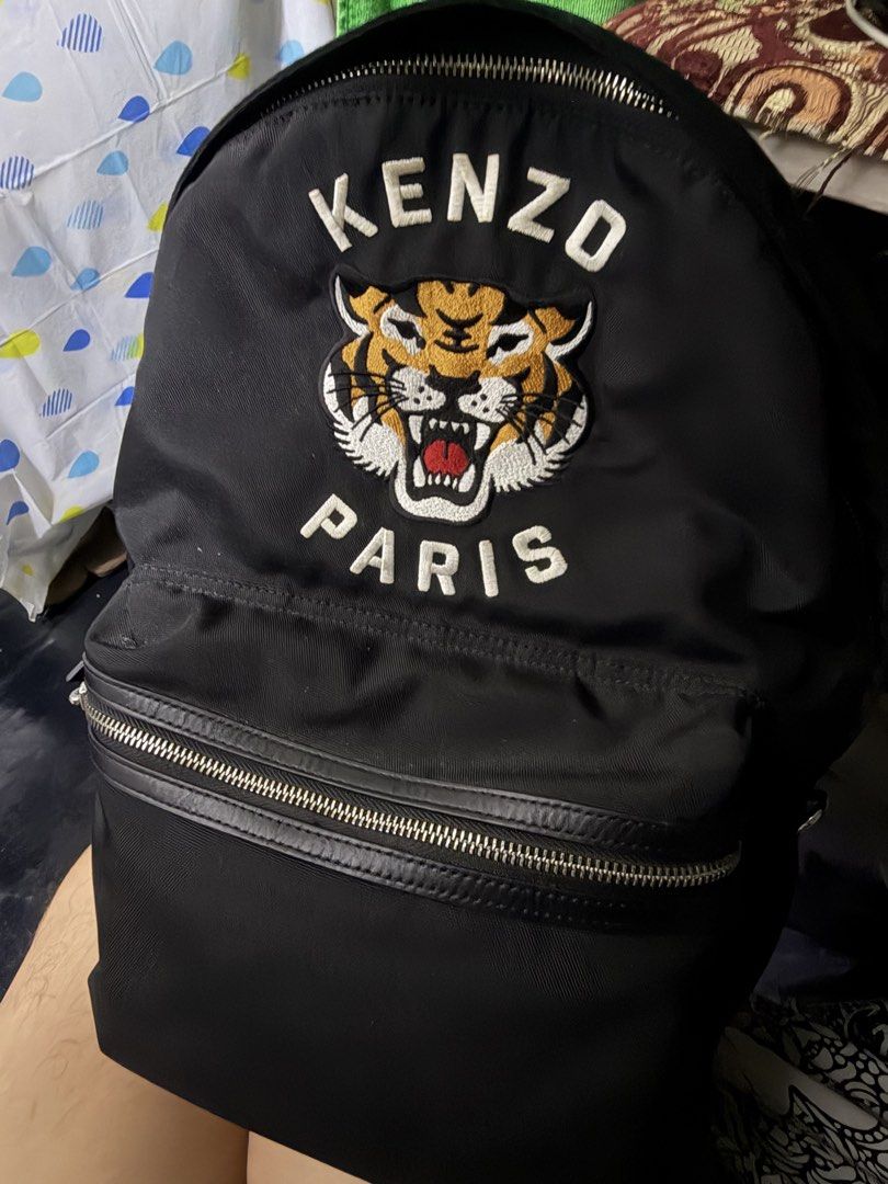 KENZO Varsity Nylon Rucksack Backpack (Category: Luxury Bags & Wallets) located in Manila. Submitted by thequeennn (Listing ID 1460427078, Image 1). Description: - Brand: KENZO - Model: Varsity Nylon Rucksack Backpack - Material: Durable Nylon - Design: Iconic Kenzo tiger embroidery - Gender: Unisex - Condition: Excellent, as seen in photos - Features: Spacious interior with branded leather tag May pocket for laptop. No inclusions..