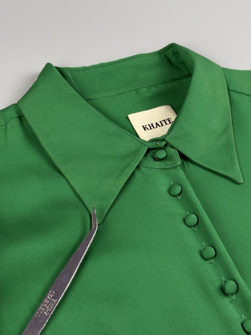 Khaite - Silk Long Sleeve Blouse (Category: Blouses) located in Pasig City. Submitted by on_the_trend (Listing ID 1460482945, Image 3). Description: Tagged size: Condition: 8/10 Flaws: Minor fadings on collar, Light marks, Minor stains, Tailor’s chalk on lining, Cut care tag/size tag Measurement: Width: 18 inches Shoulder: 15 inches Length: 20.5” (Back) / 23.5” (Front) Sleeve length: 23 inches.