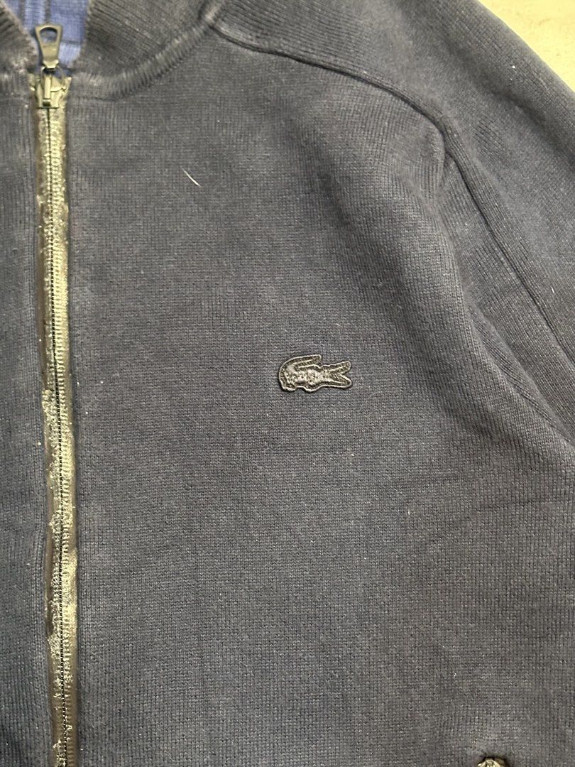 Lacoste Navy Blue Bomber Jacket (Category: Coats, Jackets and Outerwear) located in Manila. Submitted by gonthrifting (Listing ID 1460374167, Image 2). Description: Lacoste bomber jacket Authentic Dimes: 21x27 Issue check photos .