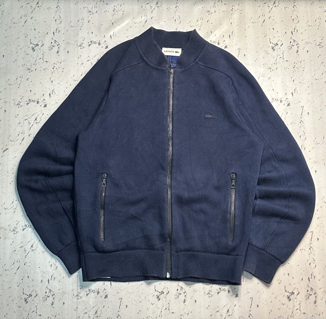 Lacoste Navy Blue Bomber Jacket (Category: Coats, Jackets and Outerwear) located in Manila. Submitted by gonthrifting (Listing ID 1460374167, Image 1). Description: Lacoste bomber jacket Authentic Dimes: 21x27 Issue check photos .