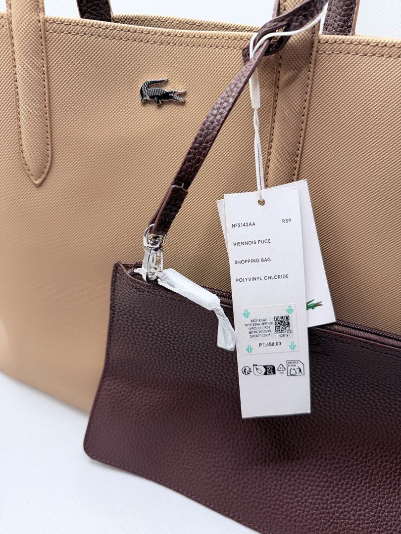 LACOSTE ORIG TOTE BAG(reversible) (Category: Shoulder Bags) located in Quezon City. Submitted by ajandstevenshopscorner (Listing ID 1460394861, Image 3). Description: May flaws pero di naman halata sa handle unused eto . Reversible Philcoa location.