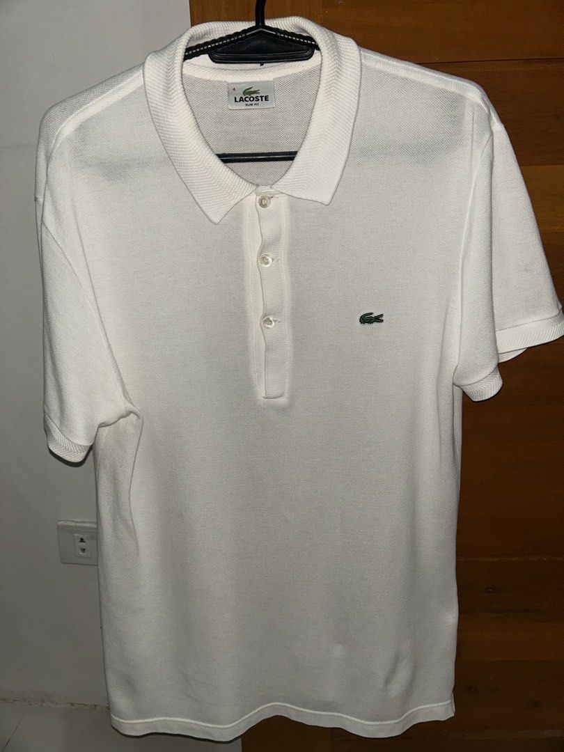 Lacoste Polo Shirt (Category: Tshirts & Polo Shirts ) located in Las Pinas. Submitted by graaalcava08002 (Listing ID 1460403646, Image 1). Description: Lacoste Polo Shirt Original Size 4 Slim Fit Width: 18.5 Length: 28 Color: White No issue..
