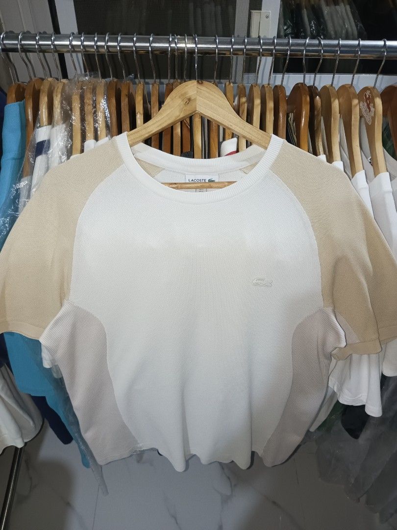 Lacoste Regular Fit T-Shirt White/Beige (Category: Tshirts & Polo Shirts ) located in Paniqui. Submitted by goodasold15 (Listing ID 1460432292, Image 3). Description: - Brand: Lacoste - Color: White with Beige raglan sleeves and side panels - Fit: Regular - Size: S (US) - Material: Cotton and Polyamide - Style: Casual wear.