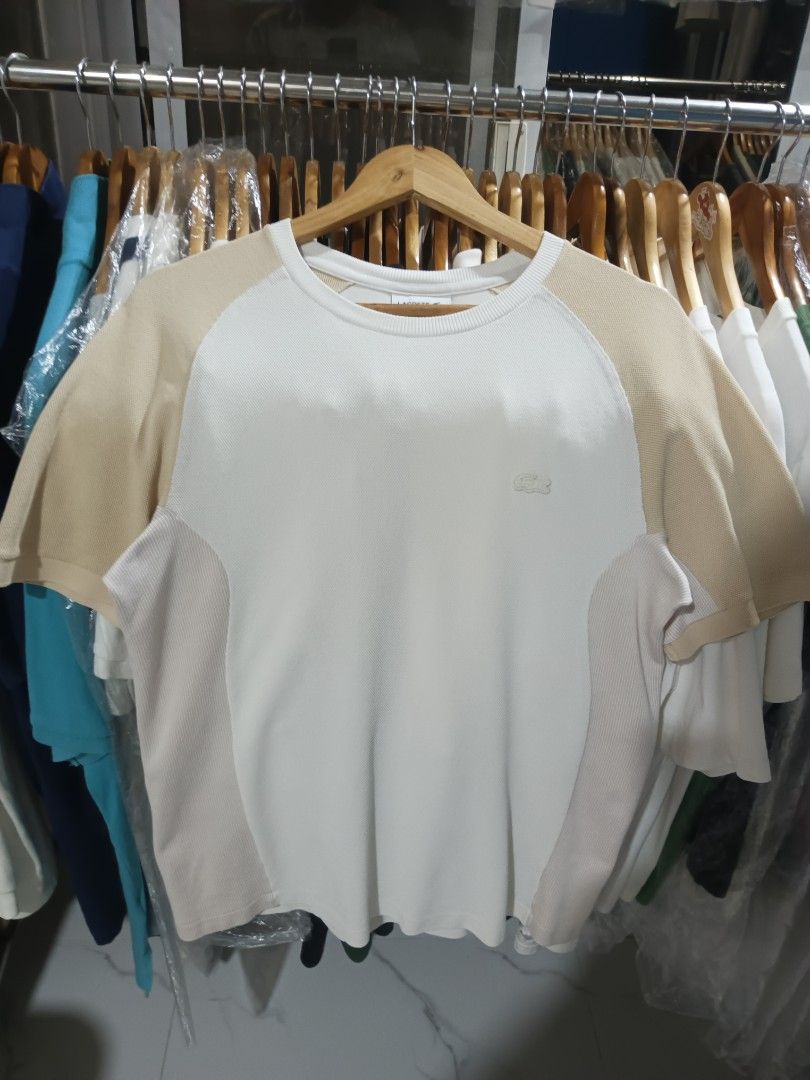 Lacoste Regular Fit T-Shirt White/Beige (Category: Tshirts & Polo Shirts ) located in Paniqui. Submitted by goodasold15 (Listing ID 1460432292, Image 1). Description: - Brand: Lacoste - Color: White with Beige raglan sleeves and side panels - Fit: Regular - Size: S (US) - Material: Cotton and Polyamide - Style: Casual wear.
