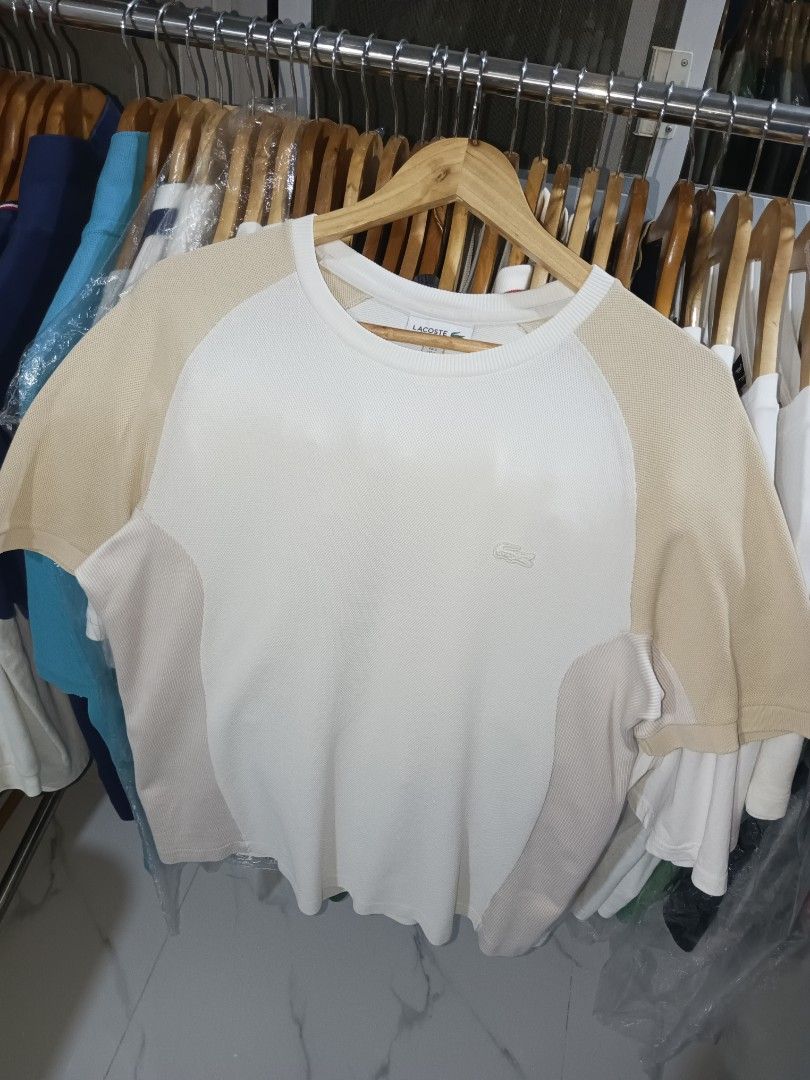 Lacoste Regular Fit T-Shirt White/Beige (Category: Tshirts & Polo Shirts ) located in Paniqui. Submitted by goodasold15 (Listing ID 1460432292, Image 2). Description: - Brand: Lacoste - Color: White with Beige raglan sleeves and side panels - Fit: Regular - Size: S (US) - Material: Cotton and Polyamide - Style: Casual wear.