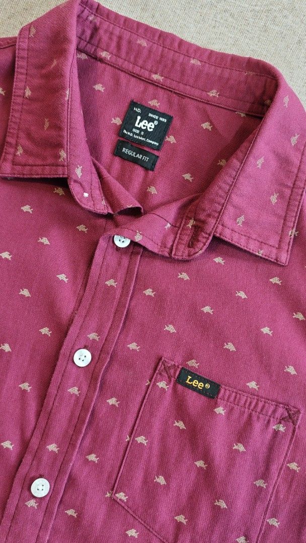 Lee Regular Fit Short Sleeve Polo (Small) (Category: Tshirts & Polo Shirts ) located in Cabuyao City. Submitted by stchristian (Listing ID 1460311269, Image 2). Description: - Brand: Lee - Color: Burgundy - Size: Small - Sleeve Length: Short Sleeve - Pattern: All-over small fish pattern - Fit: Regular Fit - Features: Chest pocket, Button-up front - Occasion: Casual wear.
