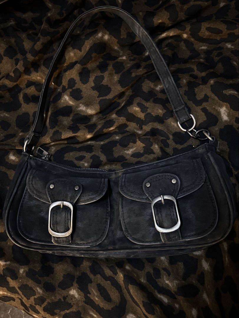 leopard Black Shoulder Bag with buckle details (Category: Shoulder Bags) located in Quezon City. Submitted by bby.4k (Listing ID 1460435849, Image 1). Description: - Stylish black shoulder bag - Two front pockets with secure buckle closures - Top zipper for main compartment security - Elegant silver hardware - Adjustable strap for comfortable wear - Ideal for everyday use - Shows some signs of wear.