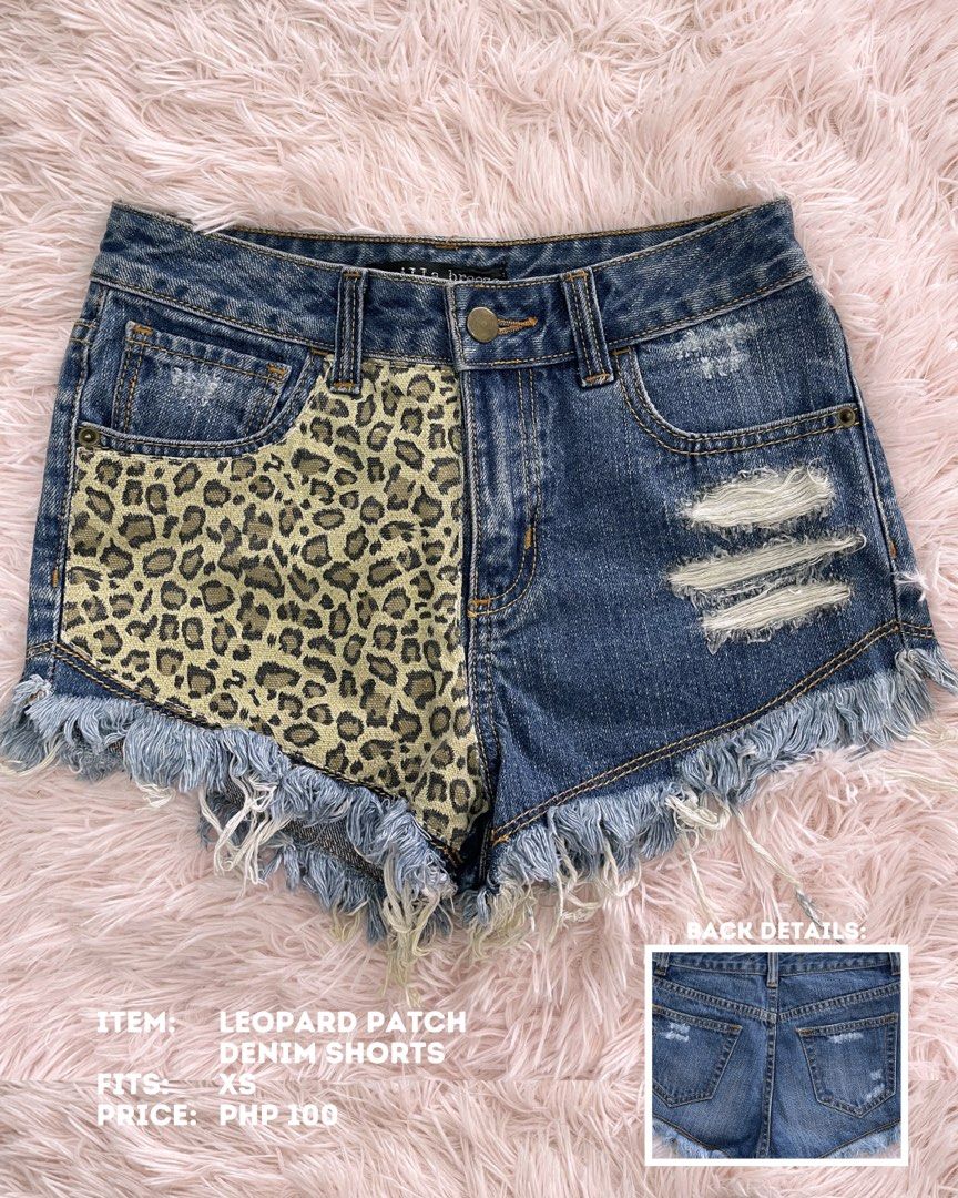 Leopard Patch Denim Shorts with Rips and Fringes (Category: Shorts) located in Batangas. Submitted by shop.aalley (Listing ID 1460336531, Image 1). Description: - Cute denim shorts - Features a leopard patch on one side - Ripped details and frayed hem - Distressed back pockets - Fits like an XS - Perfect for casual, edgy summer outfits.