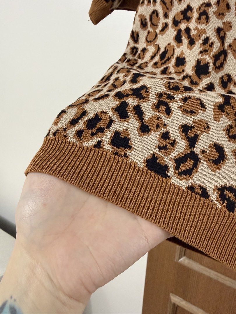 Leopard Print Collared Knit Top with Buttons (Category: Blouses) located in Baguio. Submitted by p-finds (Listing ID 1460336162, Image 2). Description: - Adorable leopard print knit top - Features a stylish collar and front button details - Short sleeves for a breezy feel - Ribbed hem and cuffs for a snug fit -Not Faded - S-M size - Ideal for everyday casual wear.