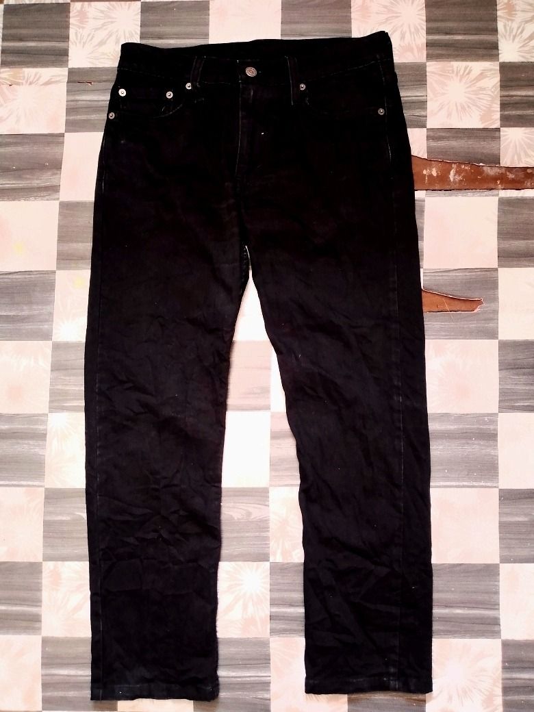 Levi's 502 Black Denim Jeans (Category: Jeans) located in Caloocan City. Submitted by alfepangasate1021 (Listing ID 1460339005, Image 2). Description: - Classic black Levi's 501 jeans - Authentic button fly closure - Standard five-pocket design - Versatile black color, perfect for any outfit - Ideal for everyday wear - Please check photos for detailed condition.