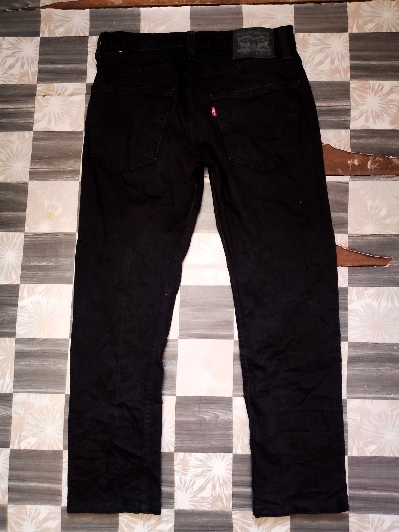 Levi's 502 Black Denim Jeans (Category: Jeans) located in Caloocan City. Submitted by alfepangasate1021 (Listing ID 1460339005, Image 3). Description: - Classic black Levi's 501 jeans - Authentic button fly closure - Standard five-pocket design - Versatile black color, perfect for any outfit - Ideal for everyday wear - Please check photos for detailed condition.