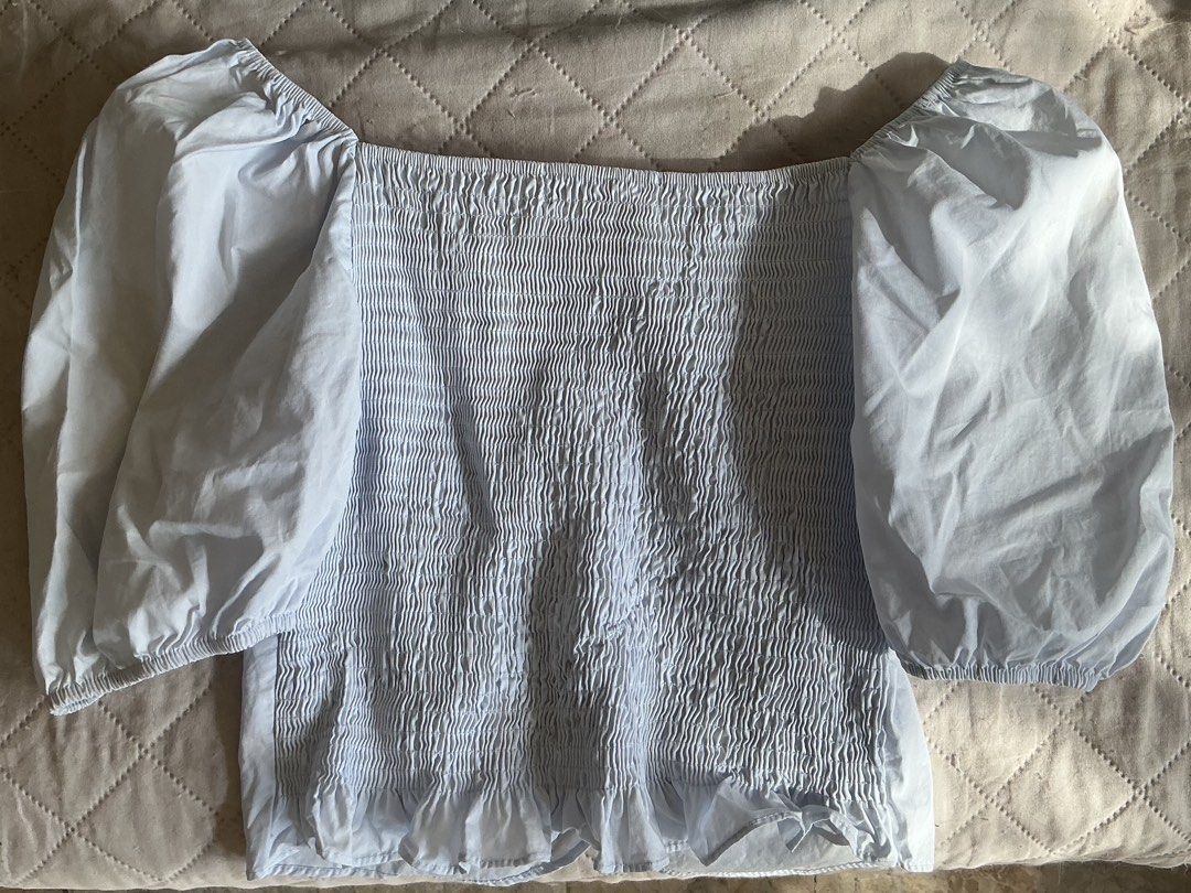 Light Blue Puff Sleeve Cottage Top (Category: Blouses) located in Pasay City. Submitted by hillene._ (Listing ID 1460348131, Image 2). Description: • Size: Medium - Large • Condition: The top is in good condition with no stains and has only been worn 1-2 times • Mode of Payment: Gcash, Bank Transfer • Mode of Delivery: Lalamove, J&T.