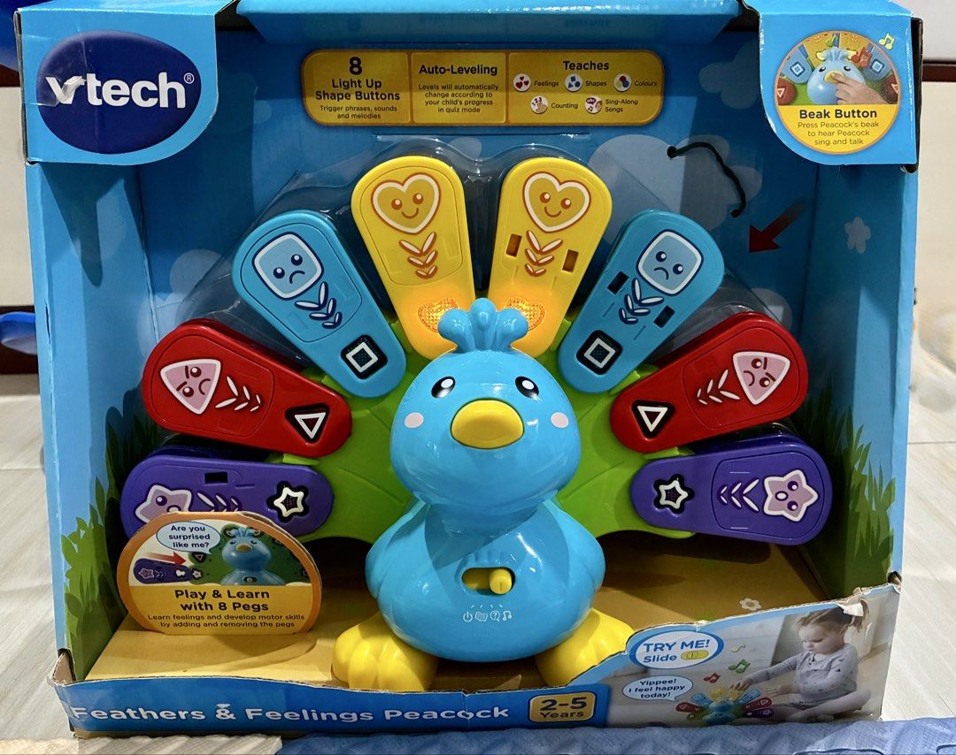 Like New VTech Feathers & Feelings Peacock Interactive Learning Toy (Category: Educational & Learning Toys) located in Quezon City. Submitted by inmycloset03 (Listing ID 1460366667, Image 1). Description: - VTech colorful peacock toy - Lights up, sings songs, and talks - Teaches colors, shapes, numbers, and emotions - Features 8 interactive pegs - Press the beak button to activate songs and speech - Includes 8 melodies and 2 sing-along songs.