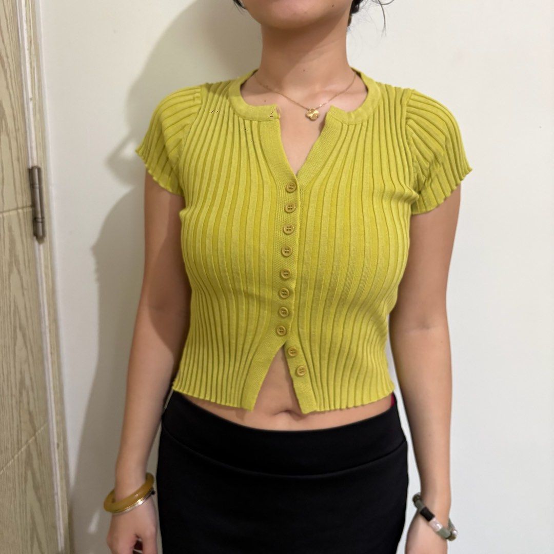 Lime Green Ribbed Button-Up Cropped Cardigan (Category: Coats, Jackets and Outerwear) located in Pasay City. Submitted by nicoletlntn_ (Listing ID 1460430549, Image 1). Description: - Cute lime green ribbed cardigan - Short sleeves with a slight puff - V-neckline with button-up front - Cropped length (hits above the waist) - Very stretchy material - Perfect for pairing with high-waisted bottoms.