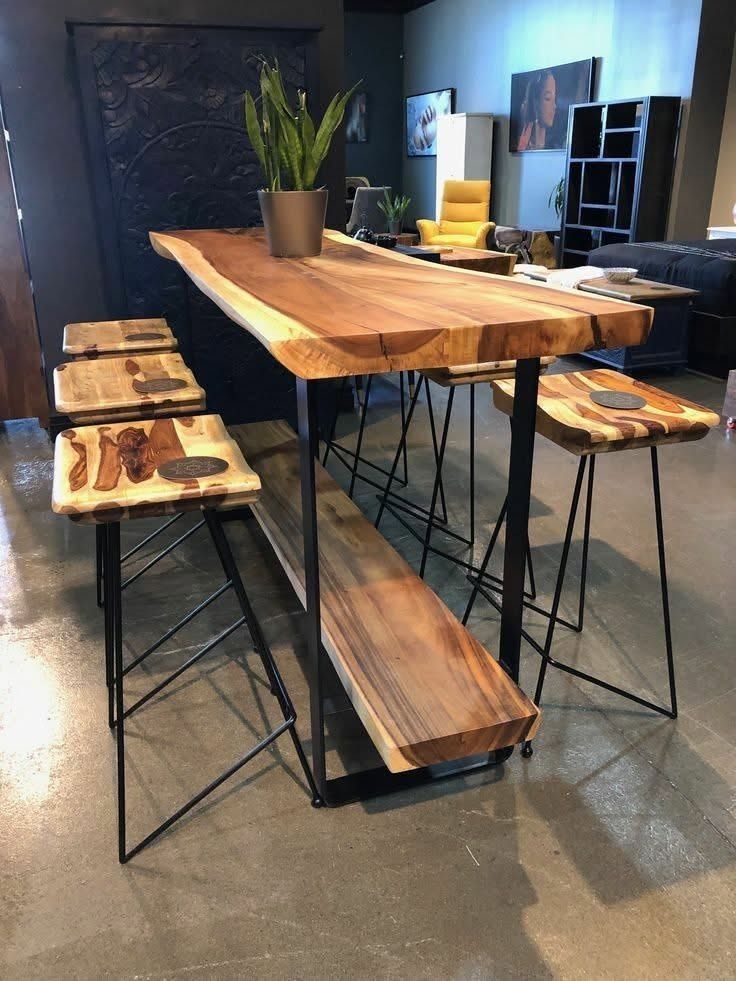 Live Edge Wood Bar Table with Stools (Category: Tables & Sets) located in Caloocan City. Submitted by blessed0fnature (Listing ID 1460480421, Image 1). Description: - Solid wood live edge bar table with unique natural wood grain. - Includes four matching stools with wood seats and metal legs. - Features a built-in wooden shelf for extra storage. - Ideal for use as a kitchen island or in a small dining area. - Beautiful natural wood finish..
