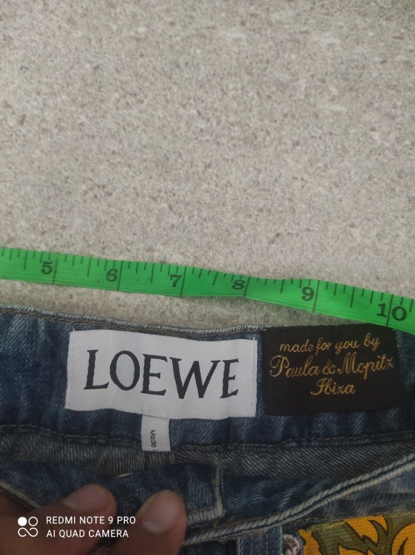 LOEWE Patchwork Denim Shorts (Category: Shorts) located in Santa Rosa. Submitted by y2kstylist (Listing ID 1460363771, Image 3). Description: - LOEWE denim shorts - Unique patchwork fabric details - Frayed hem - Made in Italy - Perfect for a statement look size 27 authentic last price na Loewe engraved lahat ng button.