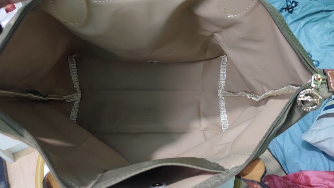Longchamp Le Pliage Tote Bag Khaki (Category: Luxury Bags & Wallets) located in Antipolo. Submitted by robannrave98496 (Listing ID 1460399810, Image 3). Description: olive green Longchamp Le Pliage tote bag - Genuine leather handles and trim - Secure zipper closure with snap button flap - Interior pocket for essentials - Made in Tunisia - Ideal everyday bag.