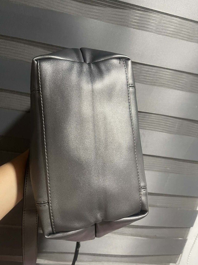 Longchamp Metallic Grey Leather Handbag with Strap (Category: Luxury Bags & Wallets) located in Antipolo. Submitted by robannrave98496 (Listing ID 1460362451, Image 3). Description: Longchamp handbag - Color: Metallic Grey - Made in France - Top zip closure - Flap with snap button closure - Interior zippered pocket - Detachable shoulder strap included - Clean interior and exterior - Perfect for everyday use.