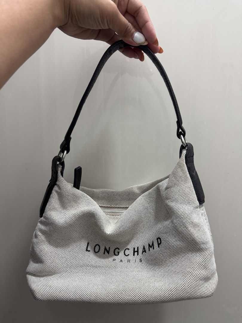 Longchamp Paris Canvas Leather Trim Shoulder Bag (Category: Luxury Bags & Wallets) located in Davao. Submitted by unabellac (Listing ID 1460364227, Image 2). Description: - Authentic Longchamp shoulder bag - Durable canvas material - Black leather trim - Classic Longchamp Paris logo - Secure zipper closure - Ideal for everyday use - Stylish and practical accessory.