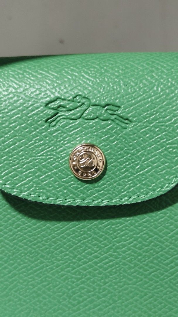 Longchamp Paris Green Leather Top Handle Bag (Category: Luxury Bags & Wallets) located in Antipolo. Submitted by robannrave98496 (Listing ID 1460366498, Image 3). Description: Green Longchamp - Made in France - Textured leather - Gold hardware details - Clean inside and out .