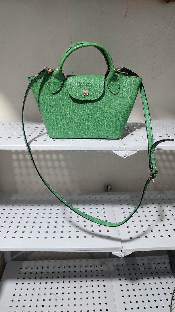 Longchamp Paris Green Leather Top Handle Bag (Category: Luxury Bags & Wallets) located in Antipolo. Submitted by robannrave98496 (Listing ID 1460366498, Image 1). Description: Green Longchamp - Made in France - Textured leather - Gold hardware details - Clean inside and out .