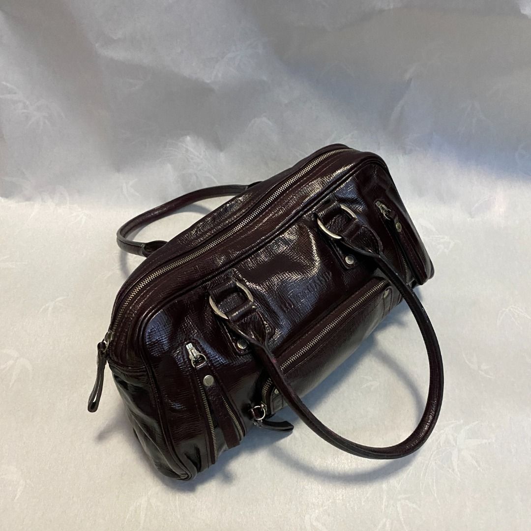 Longchamp Rodeo Luxe Y2K Burgundy (Category: Shoulder Bags) located in Antipolo. Submitted by bentakahitanoano (Listing ID 1460447810, Image 2). Description: This bag is a vintage Longchamp Rodeo Lux (Luxe) bowler/satchel bag from the mid-to-late 2000s Y2K era. During this time, Longchamp leaned heavily into premium, edgy leather collections to supplement their canvas tote offerings, creating pieces with a distinct "indie-sleaze" and rock-chic ae