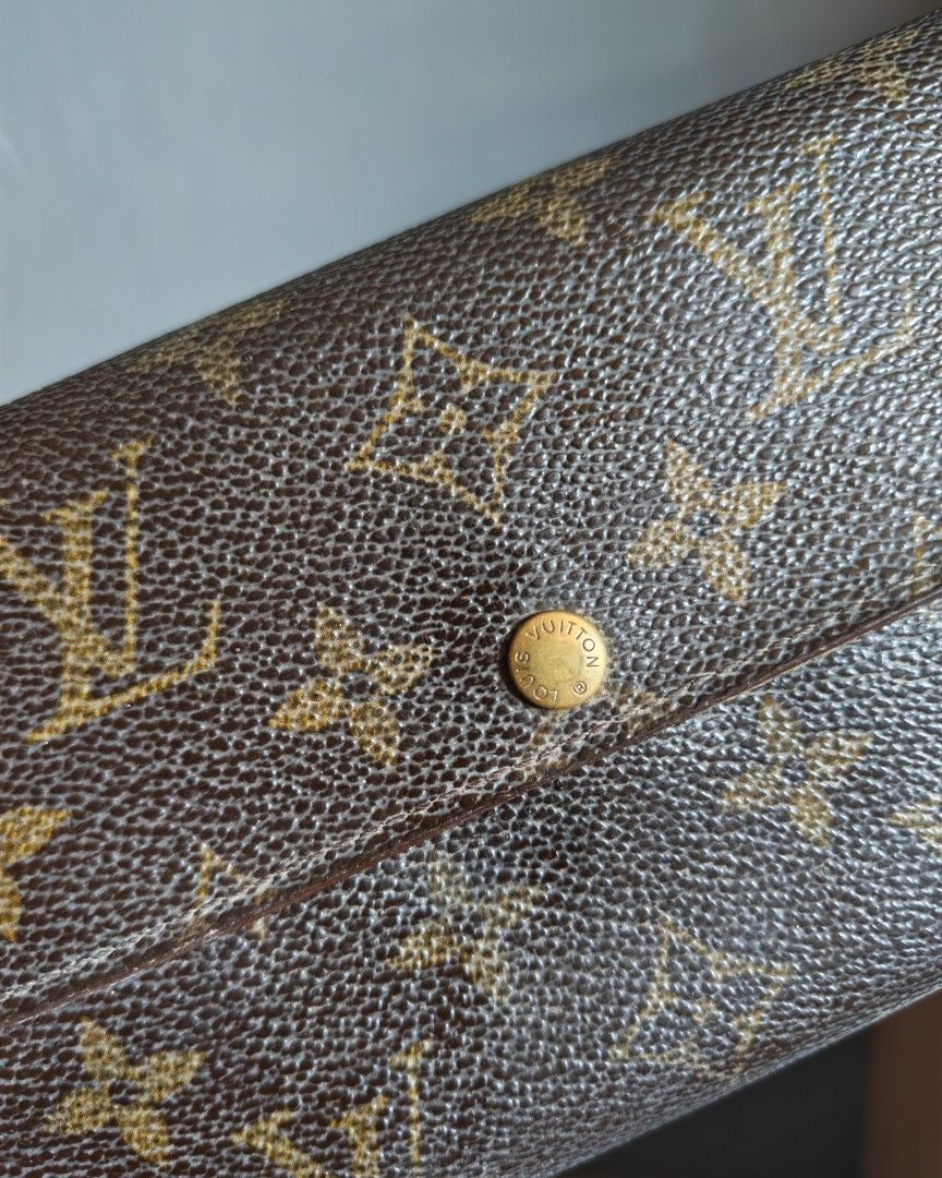 Louis Vuitton Monogram Canvas Long Wallet (Category: Luxury Bags & Wallets) located in Manila. Submitted by cleverwhale_45b7bc (Listing ID 1460485048, Image 3). Description: - Authentic Classic Louis Vuitton monogram canvas wallet - Secure snap button closure - Interior features multiple card slots and a bill compartment - Shows some signs of wear on interior leather and edges - Still a functional and stylish accessory.
