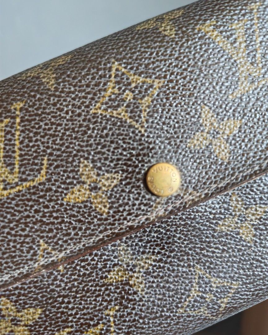 Louis Vuitton Monogram Canvas Long Wallet (Category: Luxury Bags & Wallets) located in Manila. Submitted by cleverwhale_45b7bc (Listing ID 1460485048, Image 2). Description: - Authentic Classic Louis Vuitton monogram canvas wallet - Secure snap button closure - Interior features multiple card slots and a bill compartment - Shows some signs of wear on interior leather and edges - Still a functional and stylish accessory.