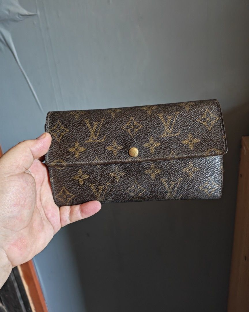 Louis Vuitton Monogram Canvas Long Wallet (Category: Luxury Bags & Wallets) located in Manila. Submitted by cleverwhale_45b7bc (Listing ID 1460485048, Image 1). Description: - Authentic Classic Louis Vuitton monogram canvas wallet - Secure snap button closure - Interior features multiple card slots and a bill compartment - Shows some signs of wear on interior leather and edges - Still a functional and stylish accessory.