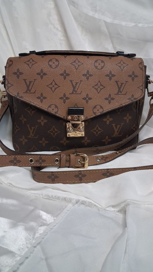 Louis Vuitton Monogram Canvas Pochette Metis Bag (Category: Luxury Bags & Wallets) located in Taguig. Submitted by divine_kitty (Listing ID 1460499080, Image 2). Description: - Classic Louis Vuitton Pochette Metis - Monogram canvas with gold hardware - Iconic LV lock closure - Multiple interior compartments for organization - Comes with an adjustable shoulder strap - Versatile for everyday or special events.