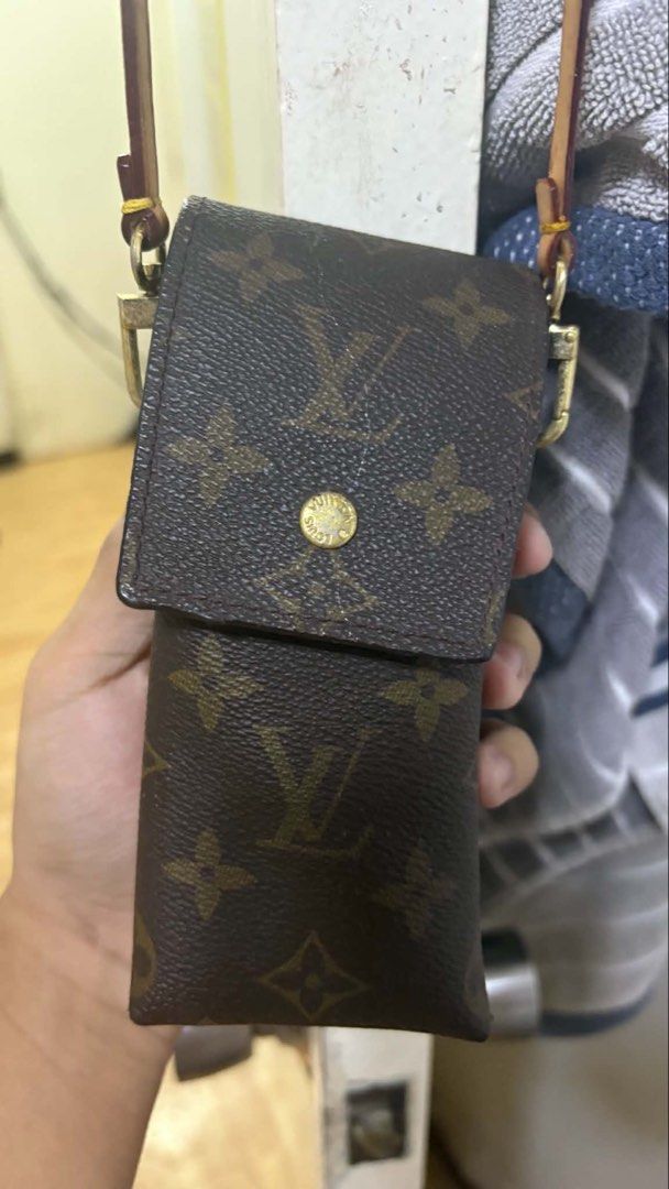 Louis Vuitton Monogram Pouch (Category: Luxury Bags & Wallets) located in Makati City. Submitted by lbrn.jms (Listing ID 1460351098, Image 1). Description: - Authentic Louis Vuitton pouch - Classic monogram canvas - Small size, ideal for essentials - Genuine leather strap - Elegant gold hardware - Secure snap button closure - Made in France.