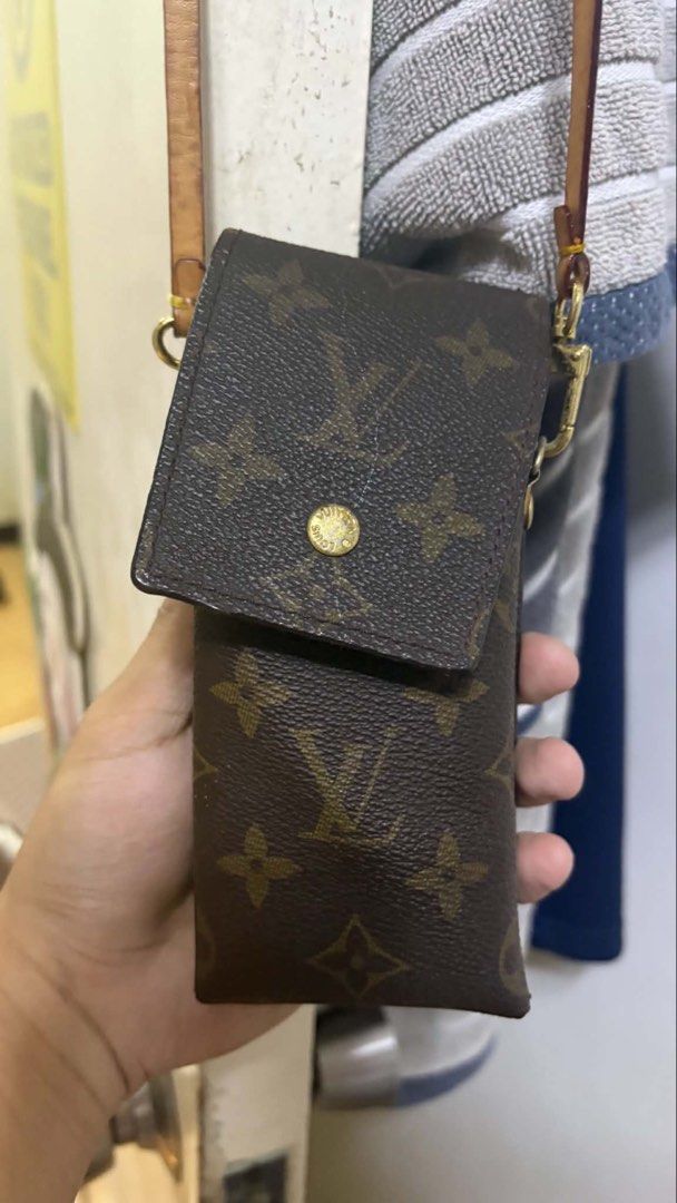 Louis Vuitton Monogram Pouch (Category: Luxury Bags & Wallets) located in Makati City. Submitted by lbrn.jms (Listing ID 1460351098, Image 3). Description: - Authentic Louis Vuitton pouch - Classic monogram canvas - Small size, ideal for essentials - Genuine leather strap - Elegant gold hardware - Secure snap button closure - Made in France.