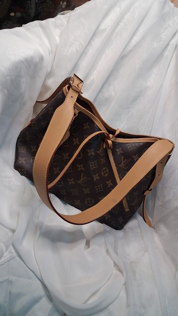 Louis Vuitton Monogram Shoulder Bag (Category: Luxury Bags & Wallets) located in Taguig. Submitted by divine_kitty (Listing ID 1460498581, Image 2). Description: - 9shoulder bag - Classic monogram canvas - Tan leather trim and strap - Secure zipper closure - Gold-tone hardware - Protective feet on the bottom - Ideal for everyday use.