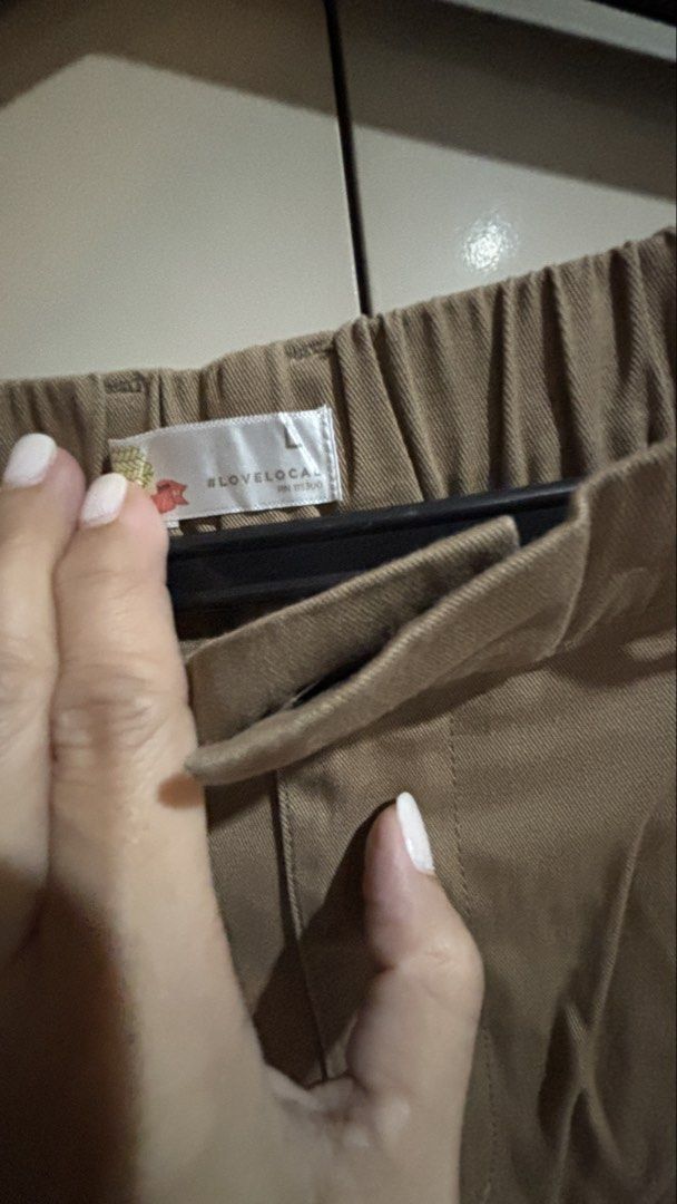 Love Local Khaki Cropped Pants (Category: Chinos) located in Manila. Submitted by daisiestuffph (Listing ID 1460328507, Image 2). Description: - Khaki cropped pants from Love Local - Comfortable elastic waistband at the back - Two front pockets and two back pockets - Stylish pleated detail at the front - Ideal for everyday casual wear Dimension Waist 32-38 stretchable garterized Length 38.5 inch.