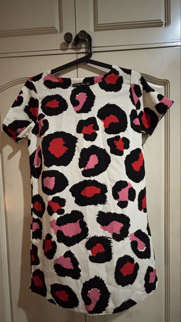 Lucky Leaves Leopard Print Dress (Category: Dresses) located in Manila. Submitted by daisiestuffph (Listing ID 1460329669, Image 1). Description: - Cute short-sleeved dress - Fun leopard print (black, red, pink spots on white) - Ideal for casual wear Dimensions Shoulder 14inch Sleeves 7.5 inch Length 32inch.