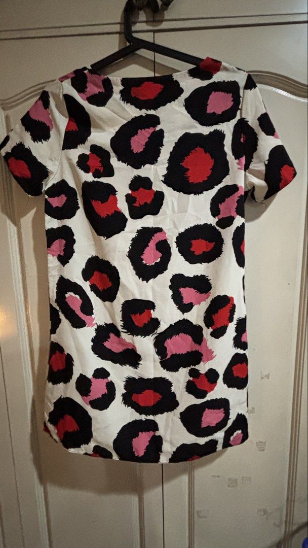 Lucky Leaves Leopard Print Dress (Category: Dresses) located in Manila. Submitted by daisiestuffph (Listing ID 1460329669, Image 3). Description: - Cute short-sleeved dress - Fun leopard print (black, red, pink spots on white) - Ideal for casual wear Dimensions Shoulder 14inch Sleeves 7.5 inch Length 32inch.