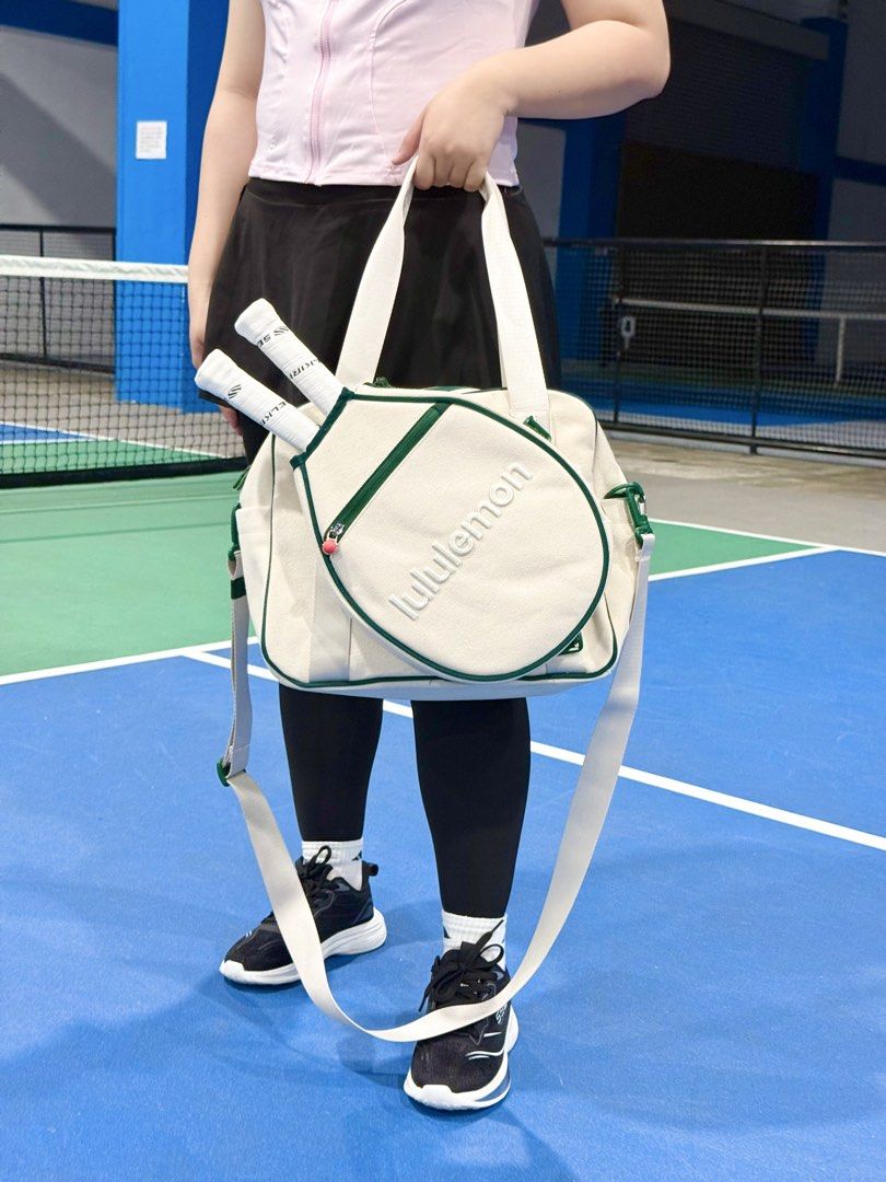 LULULEMON (Category: Luxury Bags & Wallets) located in Angeles City. Submitted by secondluxph (Listing ID 1460502760, Image 3). Description: - Lululemon Small Racket and Paddle Bag - 16.5L volume (approx. 35cm x 16cm x 29cm) - Natural/Green (Cream body with green piping and prominent white lettering) - Adjustable shoulder strap, exterior racket/paddle sleeve, and a compact main compartment for court essentials - Brandnew with hang tag (use for ph